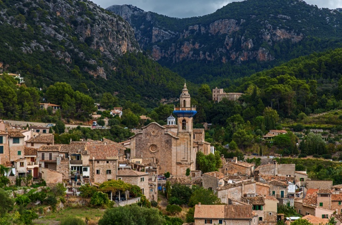 The town of Valldemossa is only around 15-20 minutes’ drive from Palma de Mallorca into the Tramuntana mountains, but feels a world away from the capital. Perched on a hilltop, surrounded by terraced terrain, Valldemossa was named after the area’s original Moorish landowner, Muza. With its car-free cobbled alleys and rich cultural heritage, the town is a treat to visit.